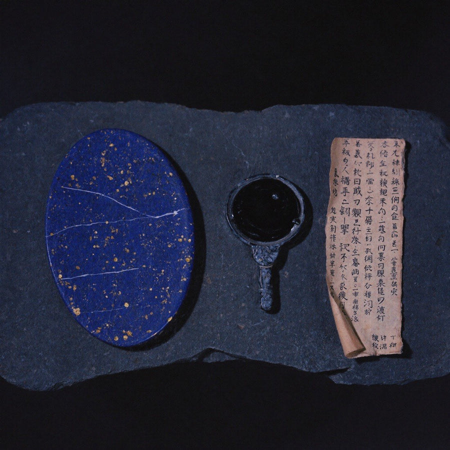 Papyrus, scrying bowl and amulet arranged for a Ka reading