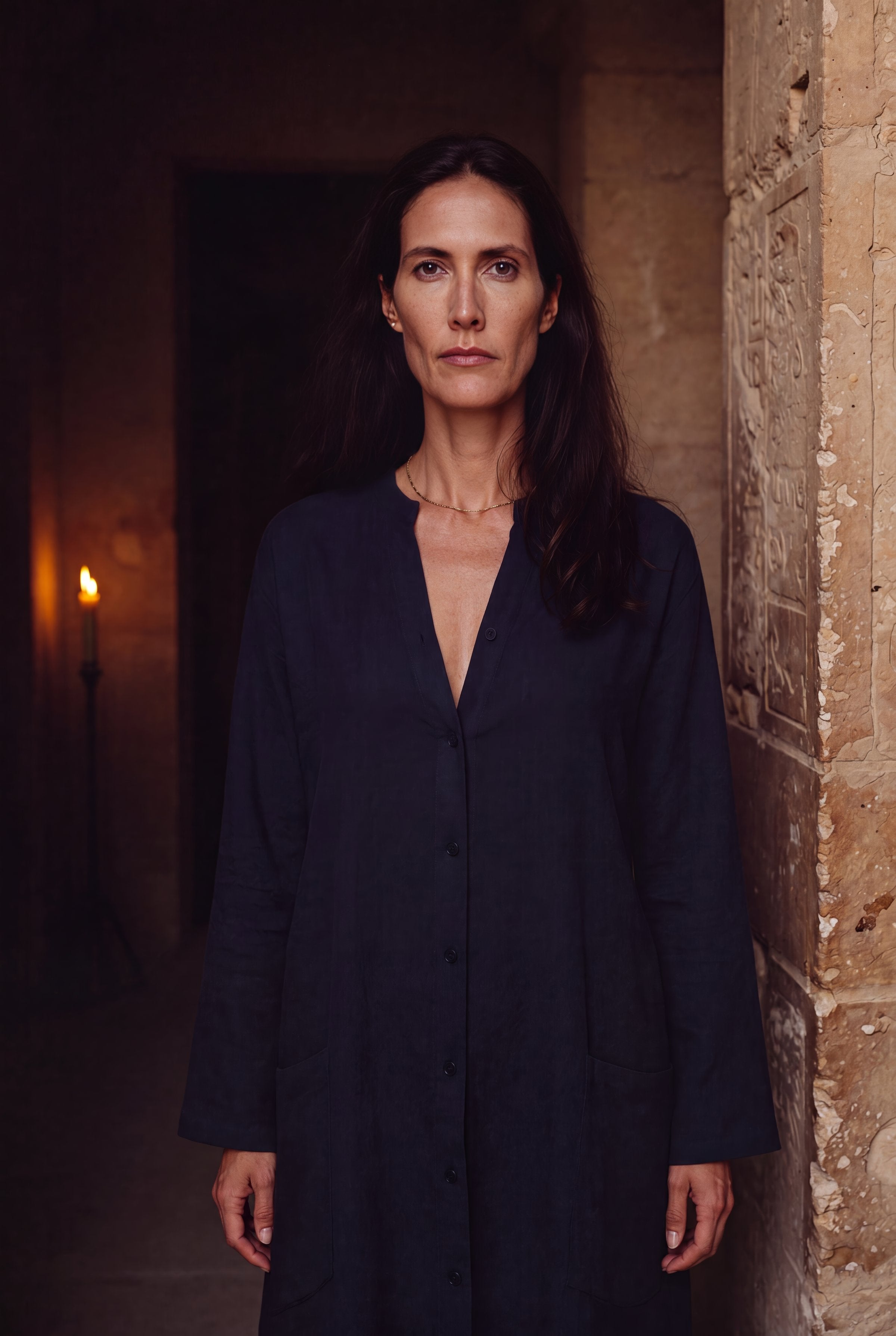 Amara el-Masri standing in the doorway of an ancient Egyptian stone corridor